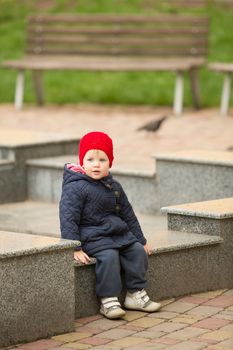 cute little girl playing in the park in spring