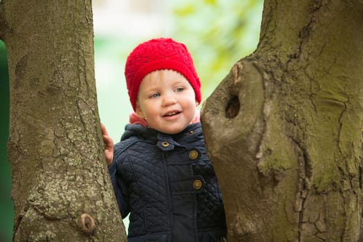 cute little girl playing in the park in spring