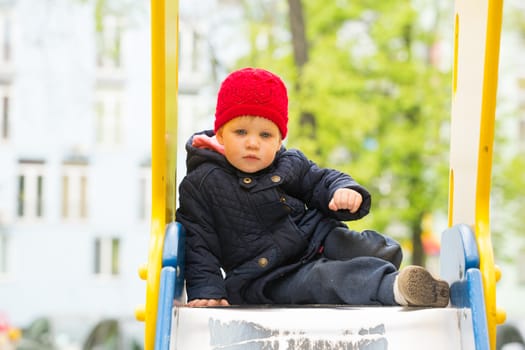 girl playing in a spring park in a playground