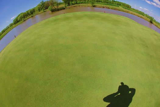 Photographer shadow with grass background at summer day