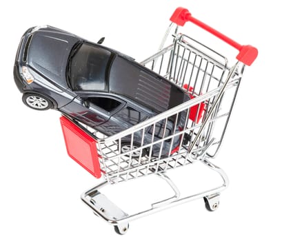 Car in shopping cart isolated on white background, closeup