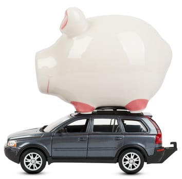 Piggy bank on car isolated on white background, side view