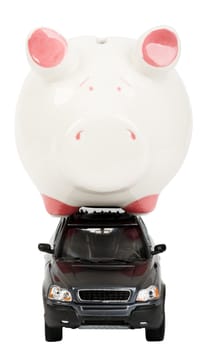 Piggy bank on car isolated on white background, front view