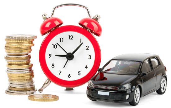 Stack of gold coins with alarm clock and car isolated on white background