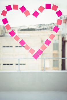 Heart in post-it on a window in office