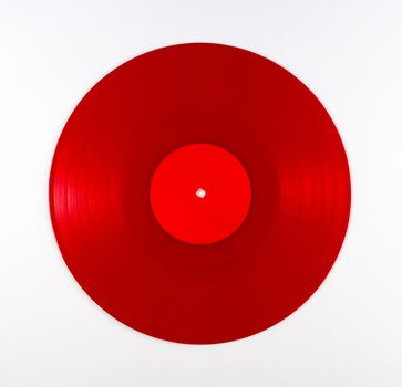 Vintage red vinyl record album on white background