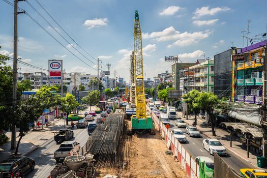 Bangkok, Thailand - November 23, 2015: Heavy traffic jams cause by the construction of the BTS skytrain on the Phahonyothin Road with clear cloud blue sky in Bangkok, Thailand