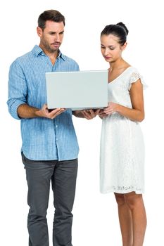 Couple using laptop standing on white screen