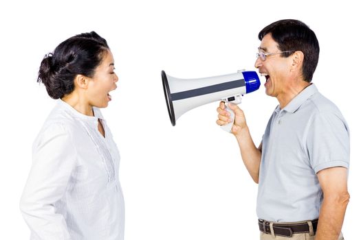 Man shouting at his partner through megaphone on white background