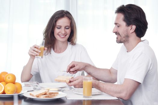 Couple having breakfast together at home 