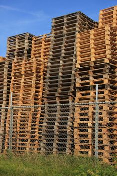 Stacked wooden pallets at a pallet storage