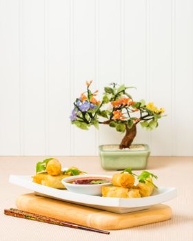 Spring Roll appetizers served with a sweet and spicy dipping sauce.