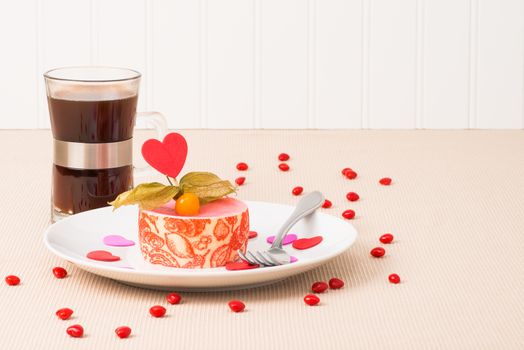 Special Valentines Day dessert served with a cup of coffee.