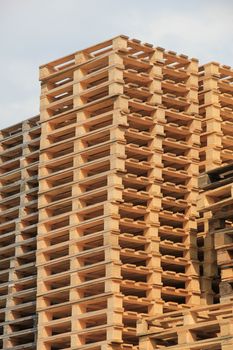 Stacked wooden pallets at a pallet storage