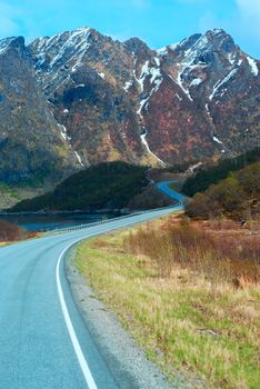 Asphalt road in Norvegian green mountains