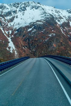Bridge on the Norwegian road in the snowbound mountains