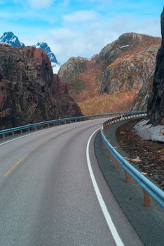 Grey road in mountains of Lofoten in Norway