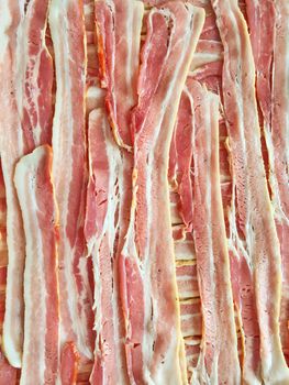 Slices of fresh bacon. Meat background.