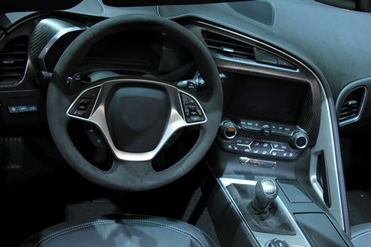 Modern car interior, luxurious materials in different shades of grey