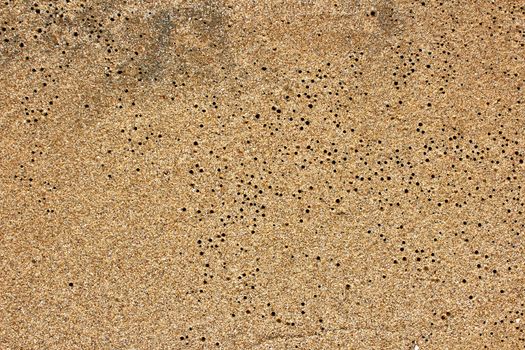 closeup of sand pattern of a beach in the summer