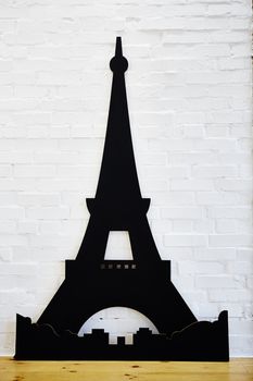 Statue of eiffel tower from cardboard on white background