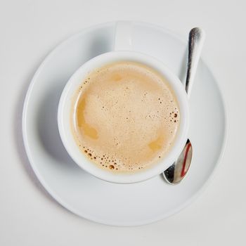 cup of fresh espresso on table, view from above