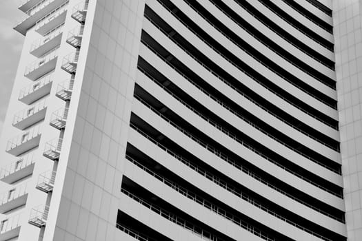 Perspective and underside angle view to textured background of modern glass building 