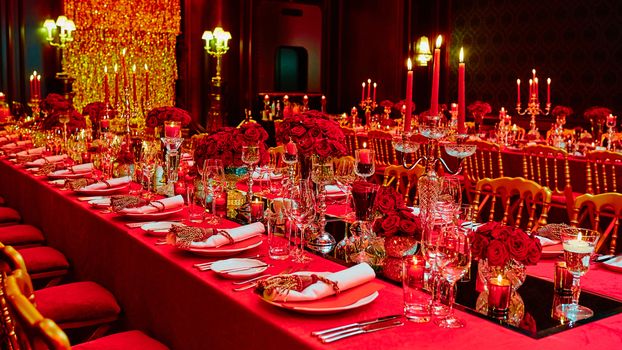 Table set for wedding or another catered event dinner in red colors