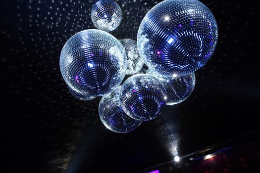 Shiny disco balls on a dark background