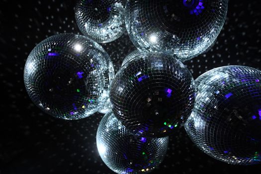 Shiny disco balls on a dark background