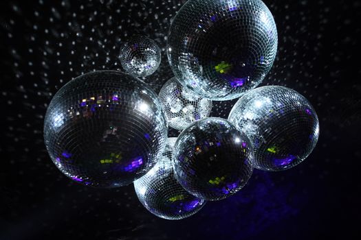 Shiny disco balls on a dark background
