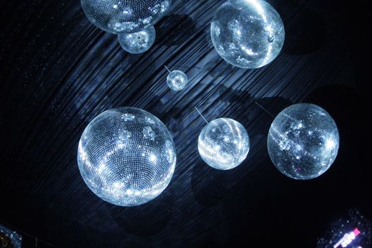 Shiny disco balls on a dark background