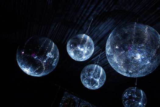 Shiny disco balls on a dark background