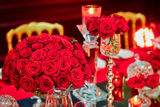 Table set for wedding or another catered event dinner in red colors