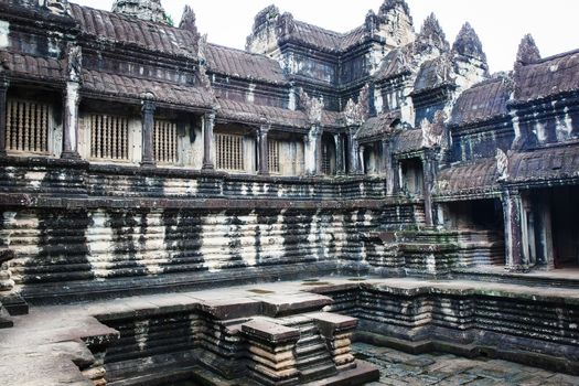 Angkor Wat Cambodia. Khmer ancient Buddhist temple under the picturesque sky with clouds and sunlight. Famous landmark, place of worship in Asia.