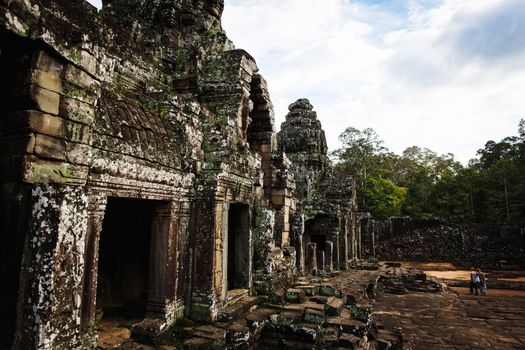 Angkor Wat Cambodia. Khmer ancient Buddhist temple under the picturesque sky with clouds and sunlight. Famous landmark, place of worship in Asia.