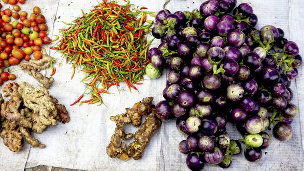 mixed vegetables purple eggplant, chili, ginger, tomato in Farmer market Luang Prabang, Laos
