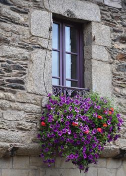 Pretty window in the small medival city of Rochefort-en-Terre, in Brittany France.One of the Plus beaux village de France