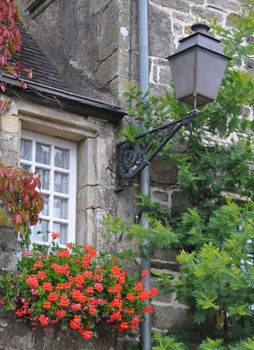 Pretty window in the small medival city of Rochefort-en-Terre, in Brittany France.One of the Plus beaux village de France