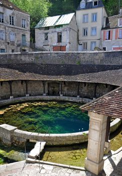 Tonnerre in the Morvan, Burgundy, France sits on the River Armancon. Famed for theTonnerre Fosse Dionne wash house