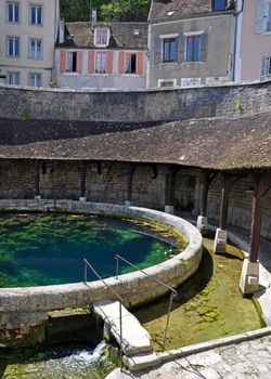 Tonnerre in the Morvan, Burgundy, France sits on the River Armancon. Famed for theTonnerre Fosse Dionne wash house