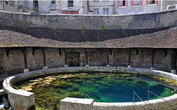 Tonnerre in the Morvan, Burgundy, France sits on the River Armancon. Famed for theTonnerre Fosse Dionne wash house