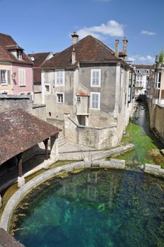 Tonnerre in the Morvan, Burgundy, France sits on the River Armancon. Famed for theTonnerre Fosse Dionne wash house