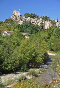 The castle at Vaison La Romain, in the Vancluse, Provence, France. The Ouveze River is in the foreground 