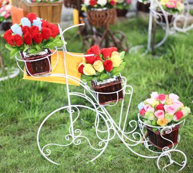 Fake flowers In basket of  bicycle