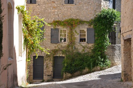 A small road in the old medieval village of Vaison-la-Romaine, in Provence, France. (taken in the Haute Ville)