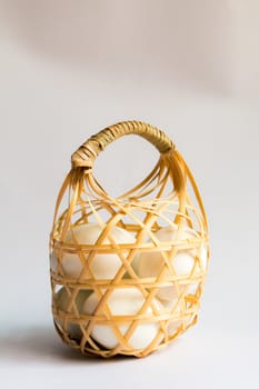 egg in basket wicker on white background,Duck eggs in baskets .