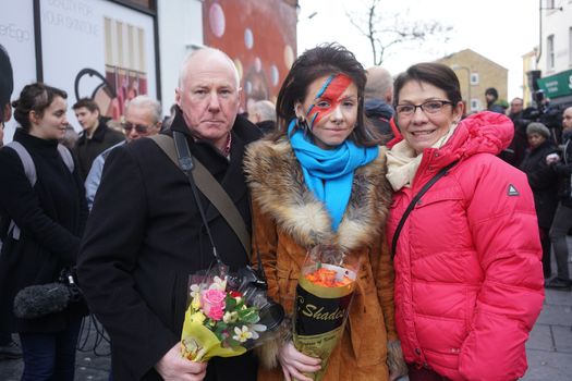 UNITED KINGDOM, London: Fans gather to pay tribute to British singer David Bowie, following the announcement of Bowie's death, in Brixton, south London, on January 11, 2016. British music icon David Bowie died of cancer at the age of 69, drawing an outpouring of tributes for the innovative star famed for groundbreaking hits like Ziggy Stardust and his theatrical shape-shifting style. 