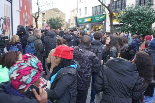 UNITED KINGDOM, London: Fans gather to pay tribute to British singer David Bowie, following the announcement of Bowie's death, in Brixton, south London, on January 11, 2016. British music icon David Bowie died of cancer at the age of 69, drawing an outpouring of tributes for the innovative star famed for groundbreaking hits like Ziggy Stardust and his theatrical shape-shifting style. 