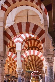 Arches Pillars Mezquita Cordoba Spain.  Created in 785 as a Mosque, was converted to a Cathedral in the 1500.  850 Columns and Arches  